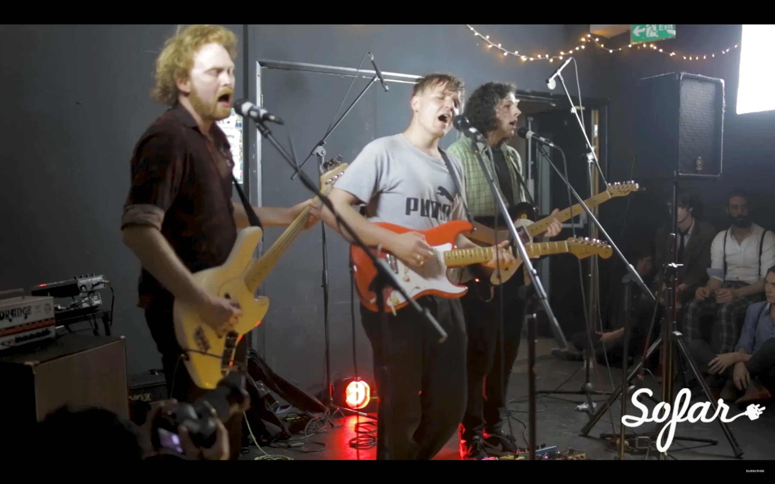 A band performing live in a room.