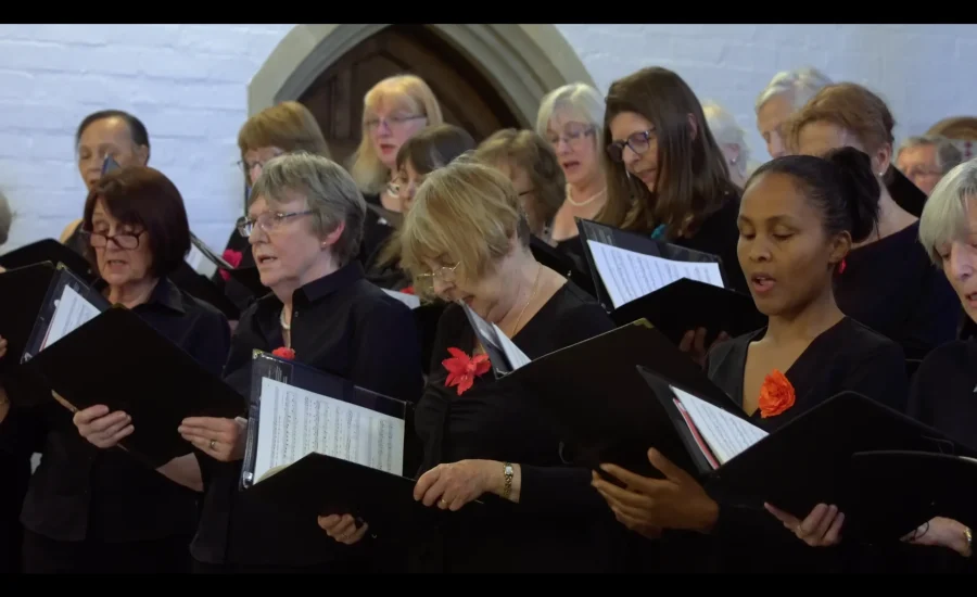 Close-up of choir singing in promotional video.