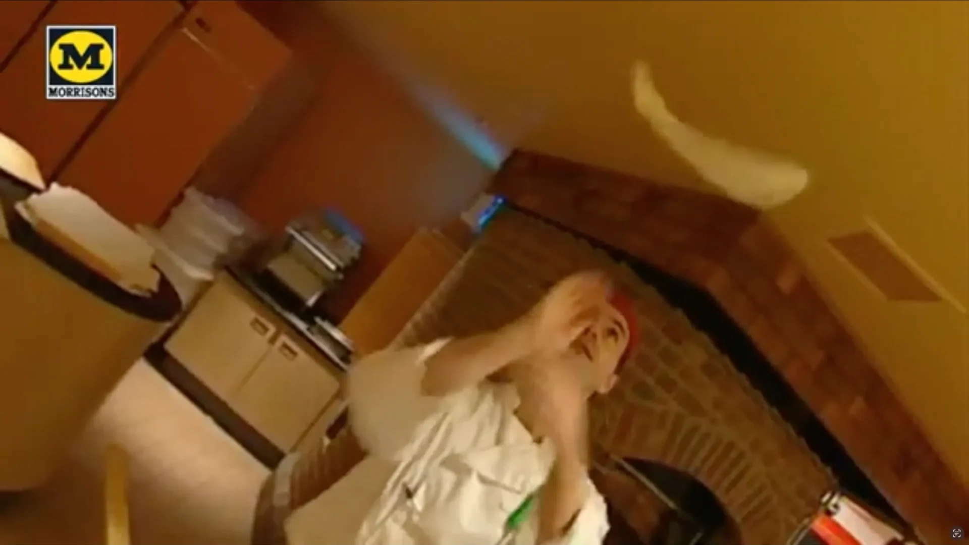 A man skillfully tosses a pizza dough high up in the air, showcasing his expertise in pizza making.